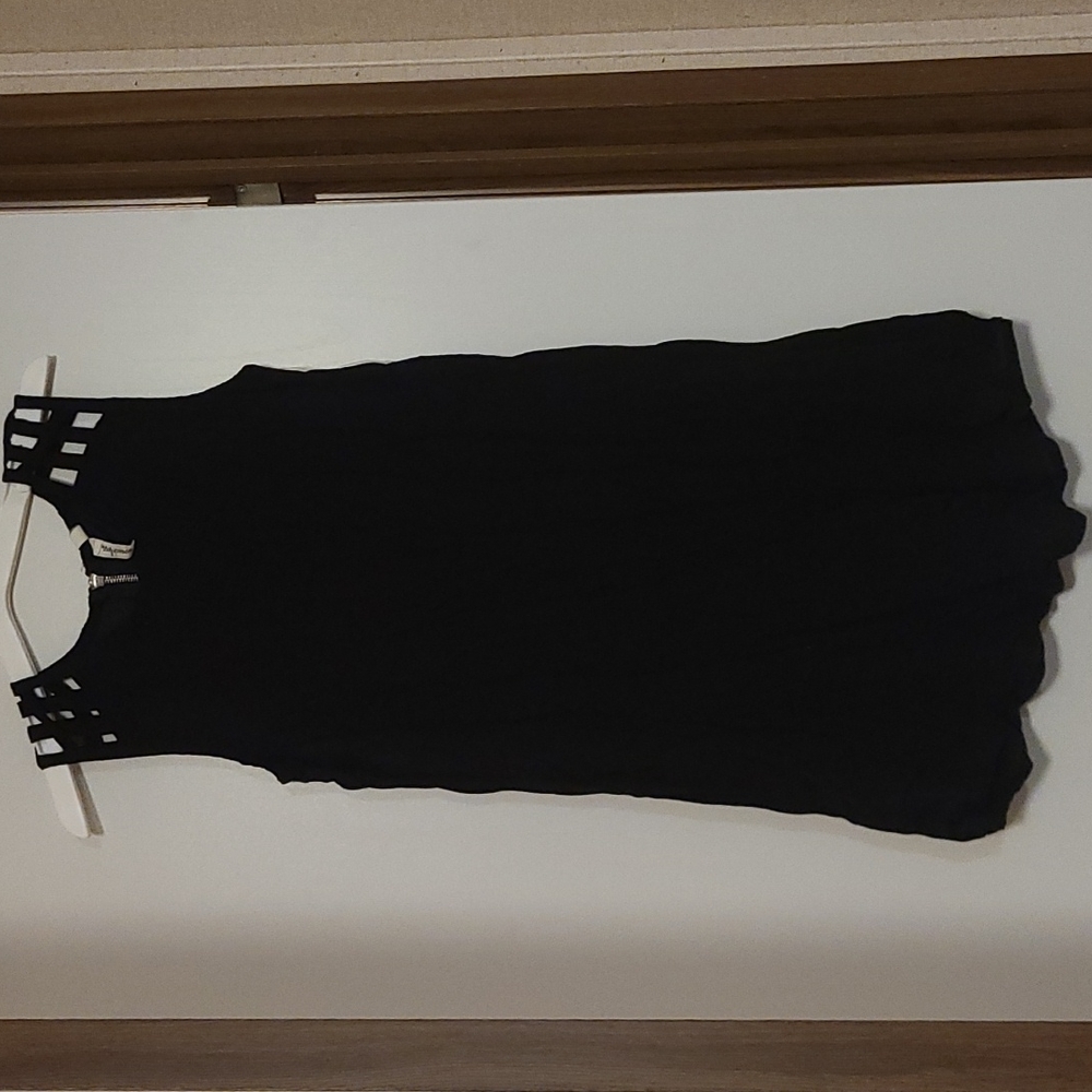 Short black dress with shoulder cutouts